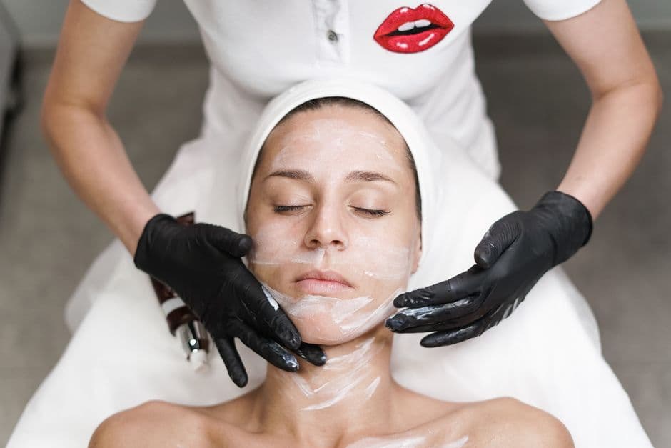 Esthetician treating a patient