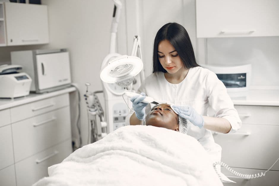 Esthetician performing a facial treatment