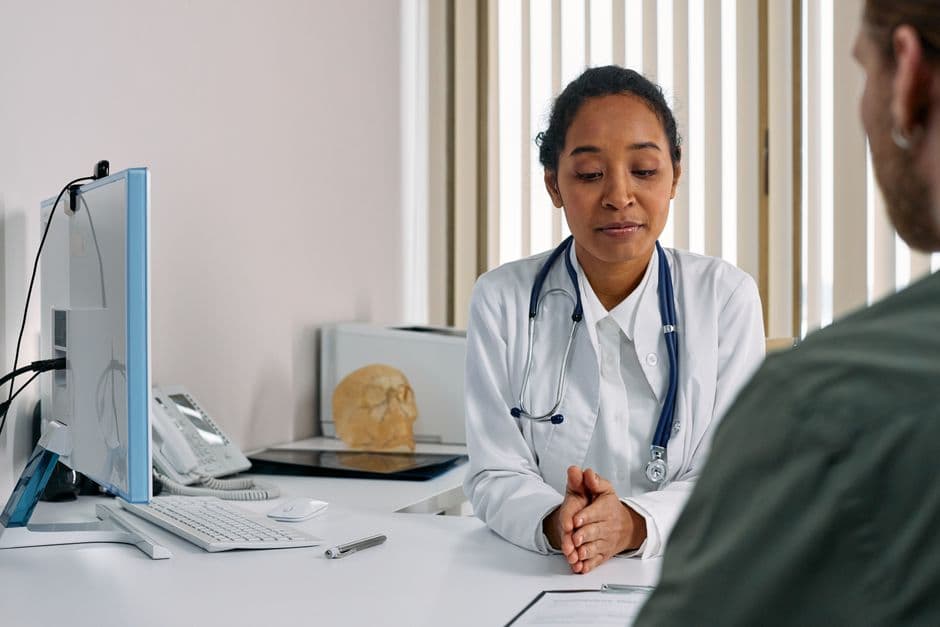 Surgeon in consultation with a patient