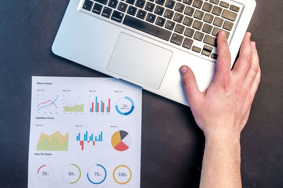 Reviewing performance charts on a laptop